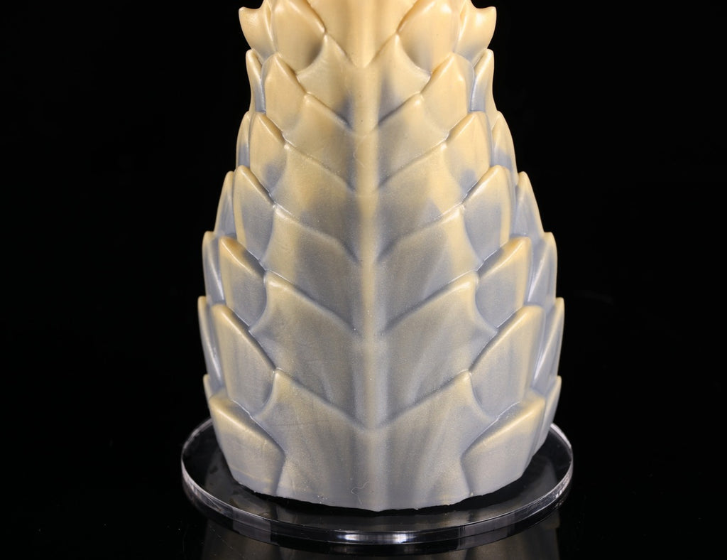 Detailed view of intricate scale patterns on dimvra-figurine mythical beast art figure.