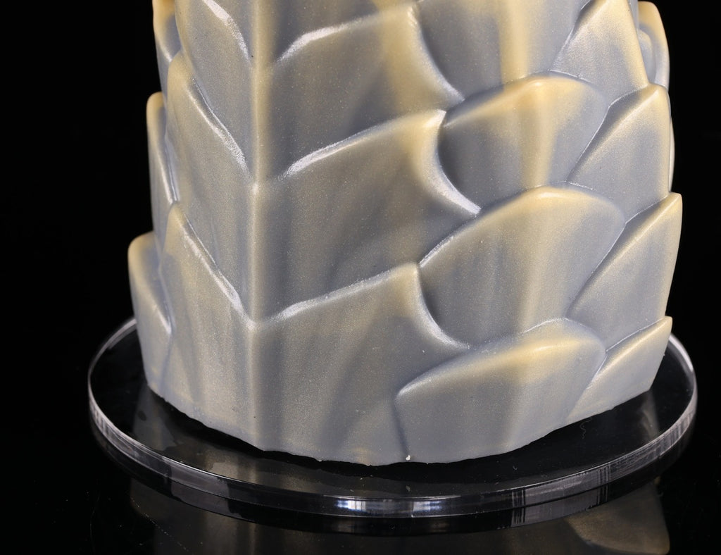 Close-up of silicone texture and scale overlap on dimvra-figurine mythical figurine base.