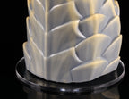 Close-up of silicone texture and scale overlap on dimvra-figurine mythical figurine base.