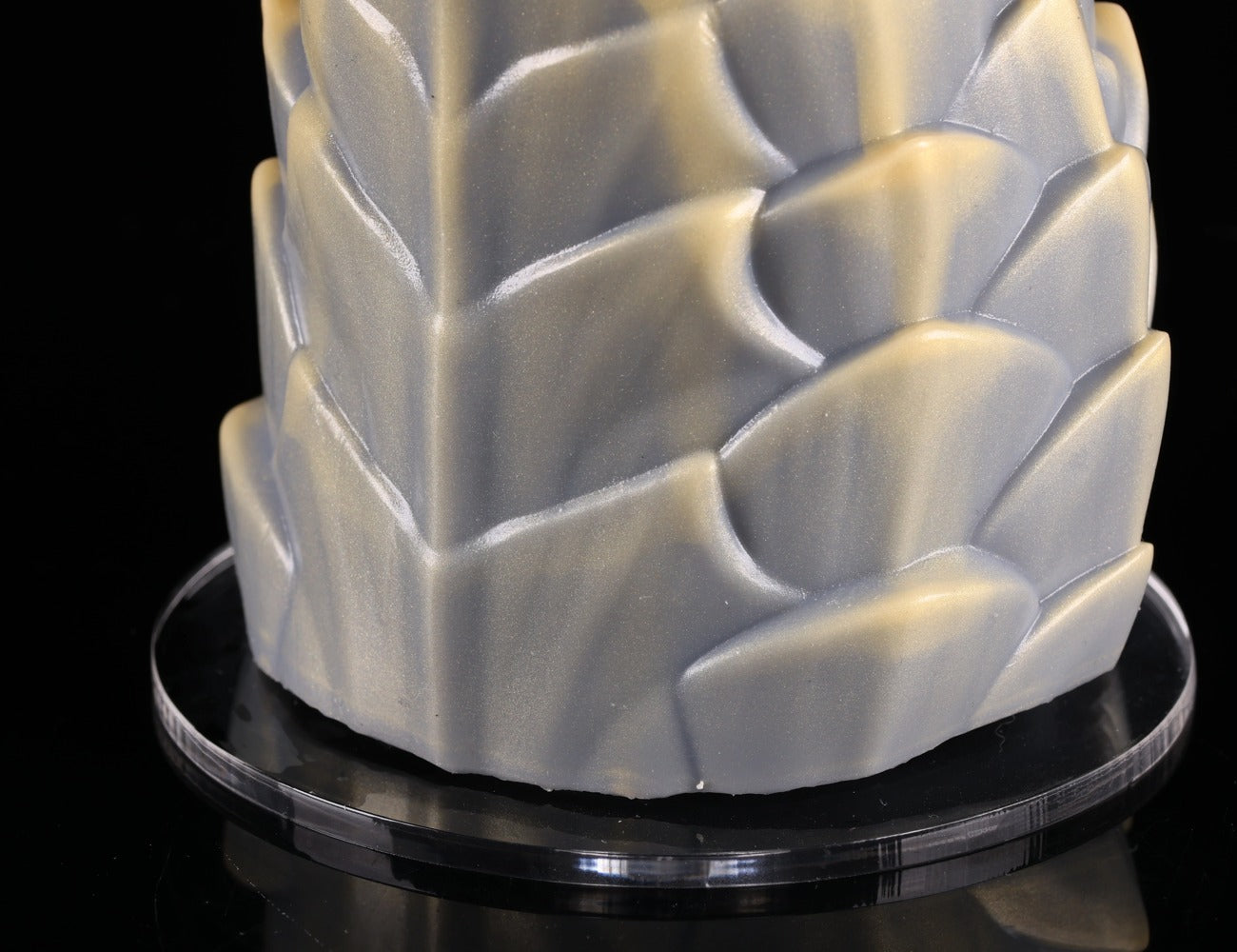 Close-up of silicone texture and scale overlap on dimvra-figurine mythical figurine base.