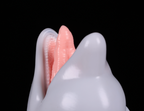 Close-up on the realistic tongue and small teeth anatomy of the dimvra-figurine marine animal figure.