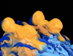 Macro view of the flowing cloud texture on dimvra-figurine Chinese dragon bust in Dunhuang colors.