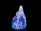 Intricate dorsal scales and blue horns on dimvra-figurine ice dragon statue.