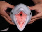 Front view of dimvra-figurine smooth dolphin head showing detailed inner mouth and throat structure.